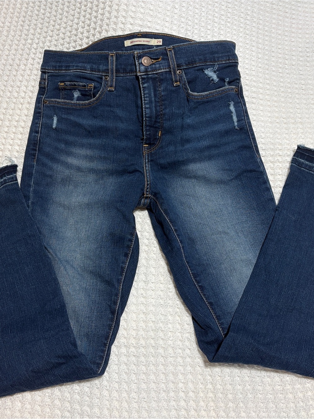 Levi's Dark Blue Skinny Jeans with Subtle Distressing